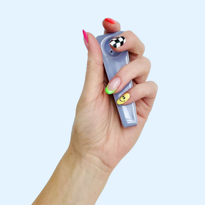 hand with a ceramic pipe